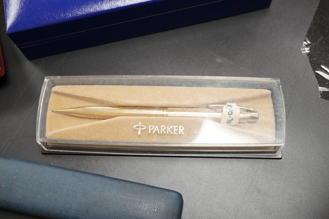 Four assorted cased Waterman pens, elven other assorted pens including Scheaffer and Parker and an engine turned silver pen.